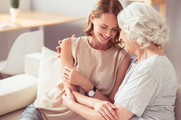 Positive senior mother and her daughter embracing — Stock Photo, Image