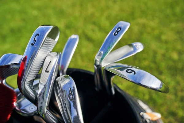 Set of numbered irons with metal clubheads — Stock Photo, Image