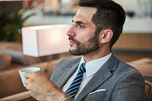 Business executive deep in thoughts with some coffee — Stock Photo, Image