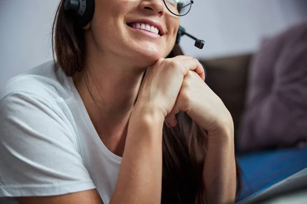 Happy young woman watching webinar at home — Stock Photo, Image
