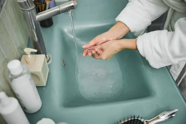 Woman cleaning hands with soap at home — Stock Photo, Image