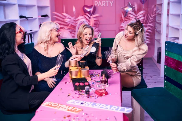 Jolly female colleagues enjoying their office party — Stock Photo, Image