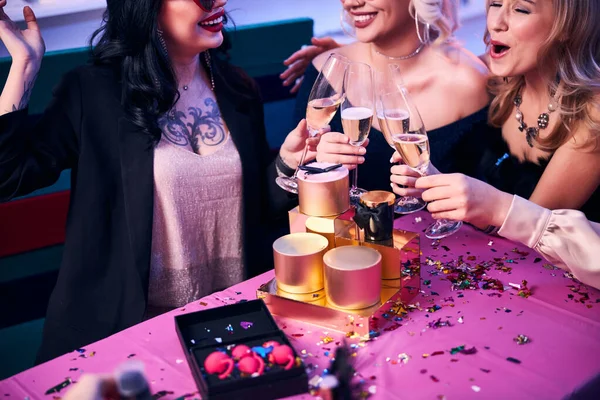 Four young ladies having a holiday party — Stock Photo, Image