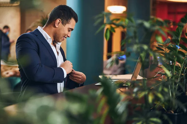 Good-humored telecommuter getting ready for a video call — Stock Photo, Image