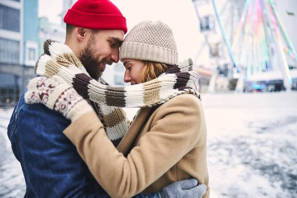 Loving couple enjoying romantic moments in winter outdoors — Stock Photo, Image