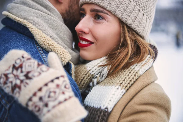 Joyful young woman spending winter time with boyfriend — Stock Photo, Image