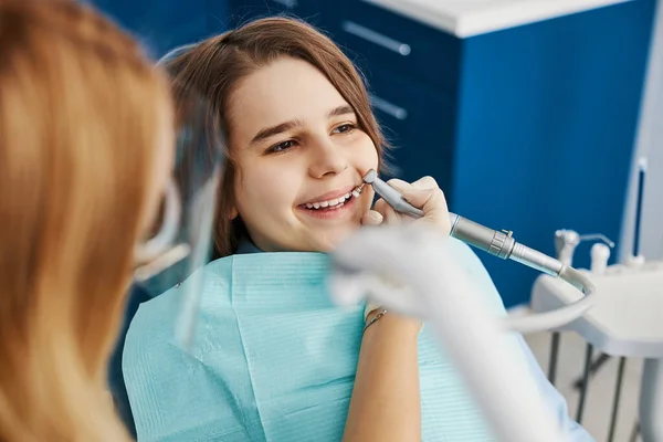 Boy loving pleasant procedure of dental polishing — Stock Photo, Image