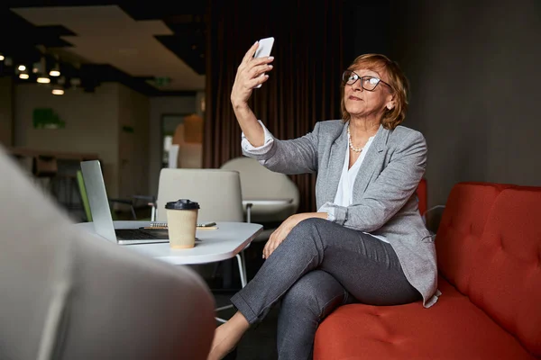 Kind mature female person having video call — Stock Photo, Image