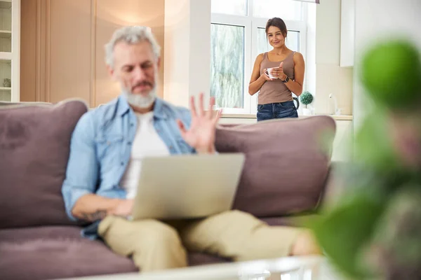 Attentive male person looking at scree of laptop — Stock Photo, Image