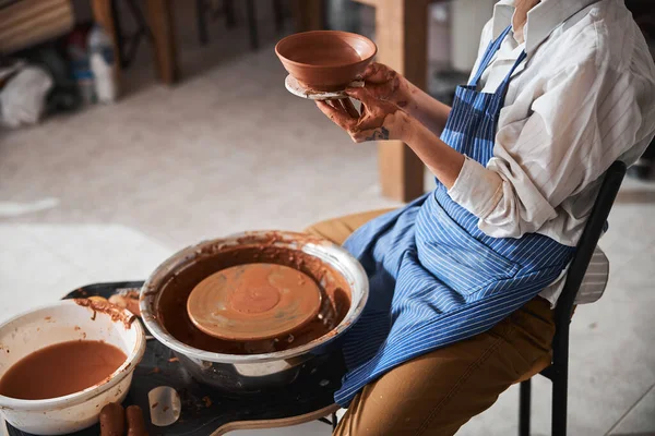 Close up of master sitting near pottery wheel — ストック写真