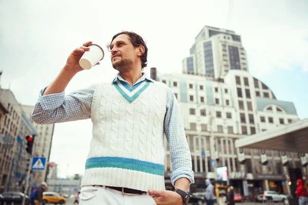 Concentrated male person looking at new buildings — Stock Photo, Image