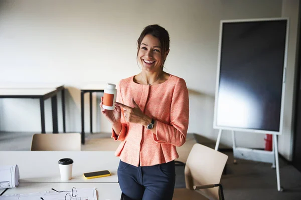 Charming young business lady in pink jacket looking and posing at the photo camera — Stock fotografie