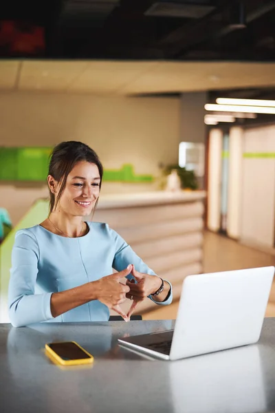 Beautiful elegant Caucasian woman personal consultant having interesting online discussion with partner in office space — Stockfoto