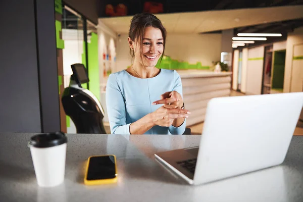 Beautiful elegant business lady in formal wear having conversation on video call while she gesturing — ストック写真