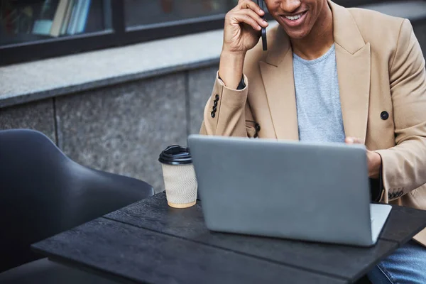 Close up of freelancer having pleasant conversation — Stock Photo, Image