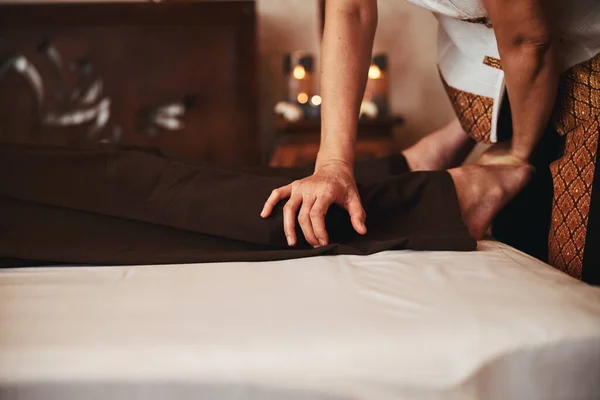 Man during traditional asian healing massage in studio — Stock Photo, Image