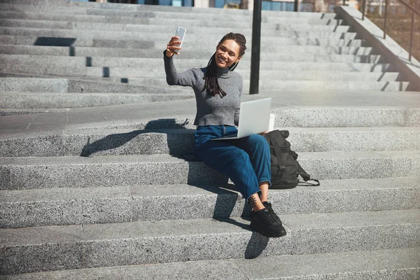 Pretty lady photographing herself with her smartphone — 스톡 사진