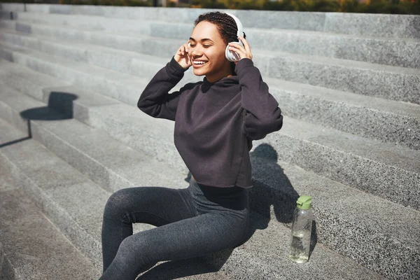 Joyful female listening to her favorite music with closed eyes — Foto de Stock