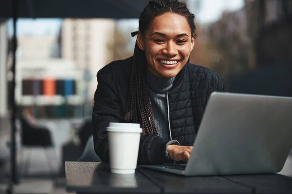 Happy lady with modern gadget sitting outdoors —  Fotos de Stock