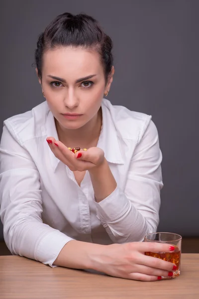 Serious woman wearing white blouse — Stock Photo, Image