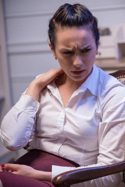 Serious woman wearing white blouse — Stock Photo, Image