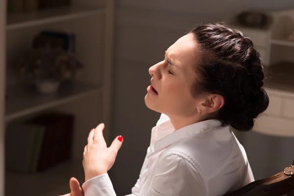 Serious woman wearing white blouse — Stock Photo, Image