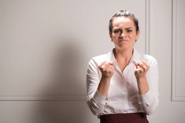 Serious woman wearing white blouse — Stock Photo, Image