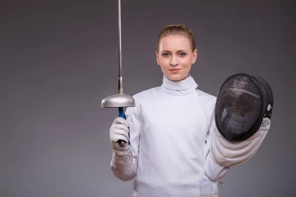 Young woman engaging in fencing — Stock Photo, Image