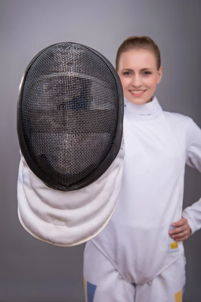 Young woman engaging in fencing — Stock Photo, Image