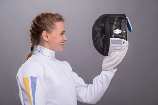 Young woman engaging in fencing — Stock Photo, Image