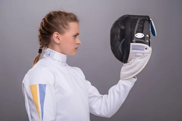 Young woman engaging in fencing — Stock Photo, Image