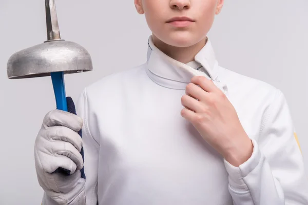 Young woman engaging in fencing — Stock Photo, Image