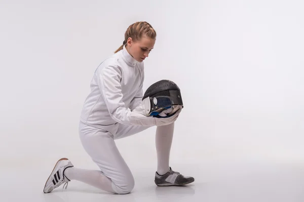 Young woman engaging in fencing — Stock Photo, Image