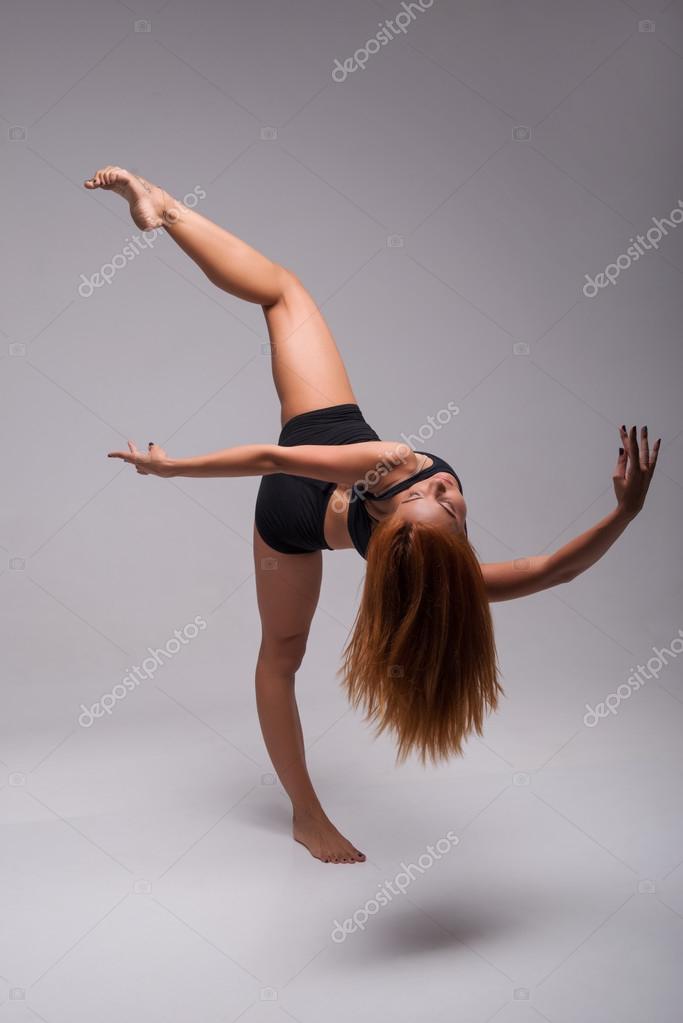 Beautiful Young Woman Stretching Her Legs She Is Wearing A White