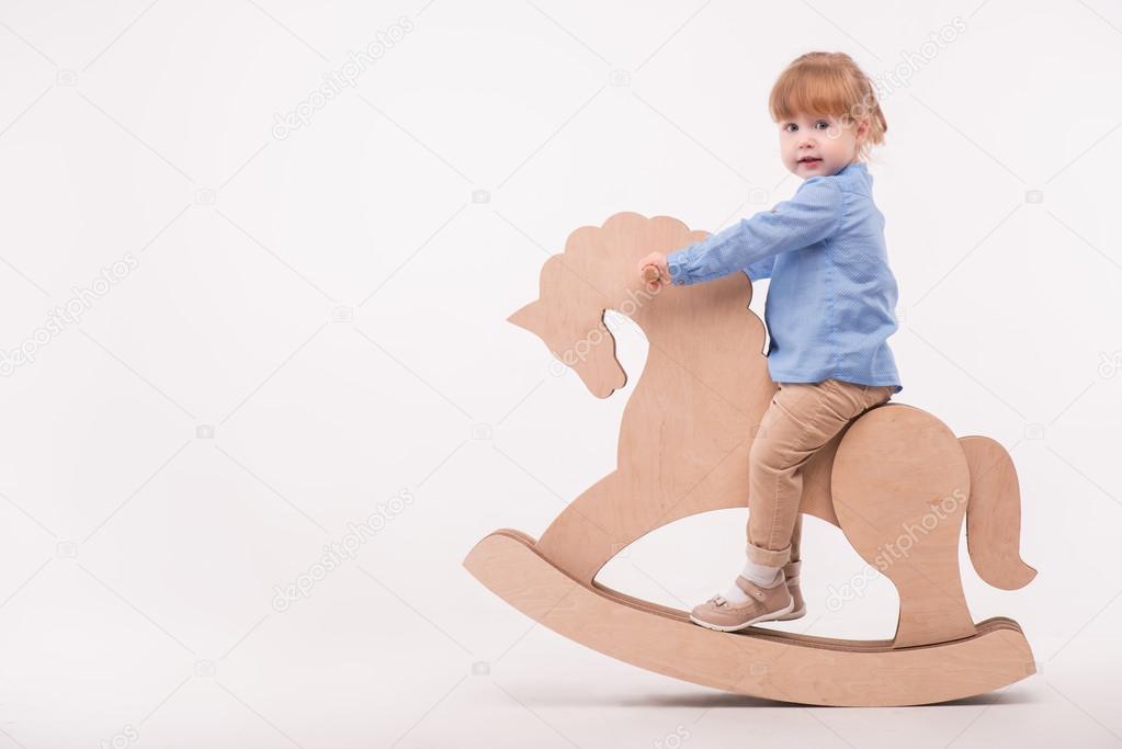 Child with the toy horse