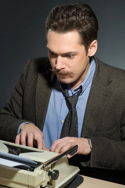 Inspired author working at the typewriter — Stock Photo, Image