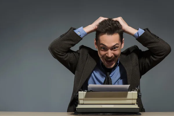 Inspired author working at the typewriter — Stock Photo, Image