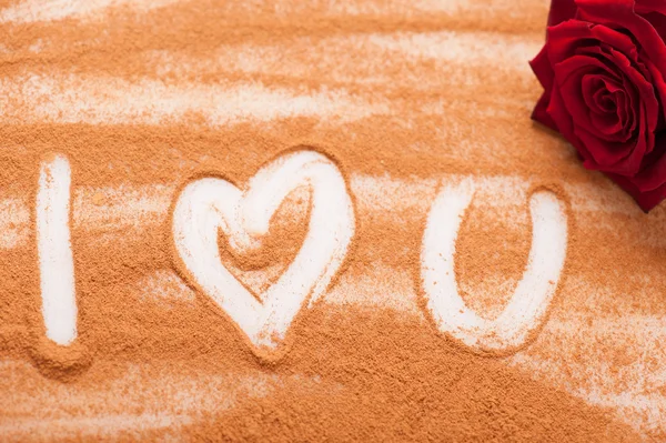 Romantic message written with chocolate powder — Stock Photo, Image