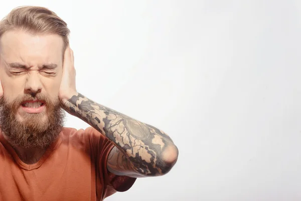 Handsome bearded man with headache — Stock Photo, Image