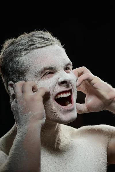 Handsome man covered with powder itching — Stock Photo, Image