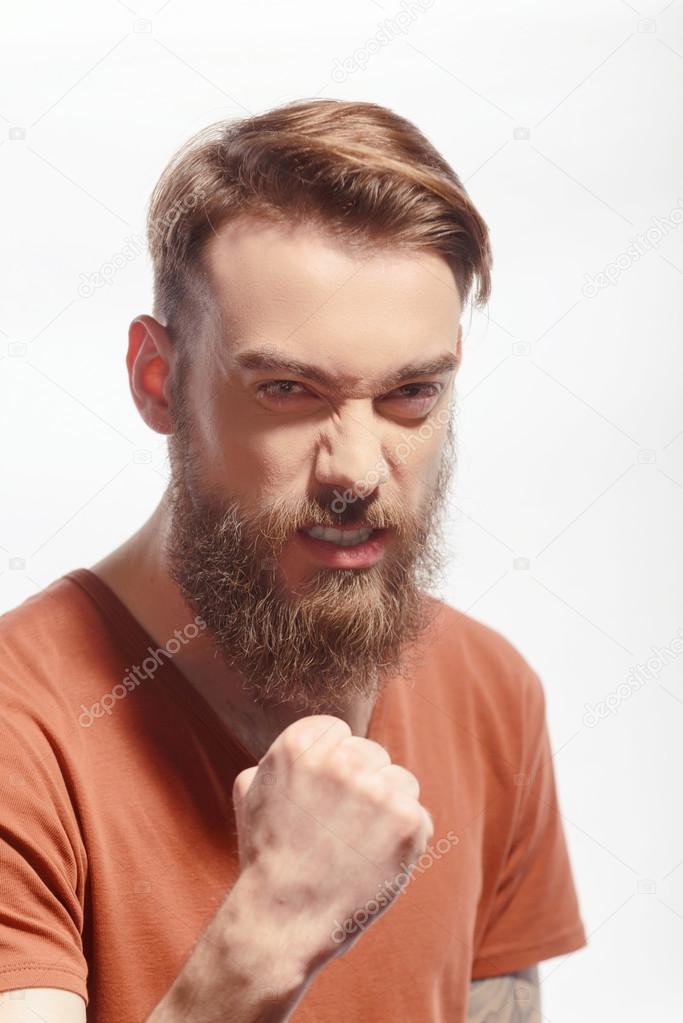 Handsome bearded man getting furious
