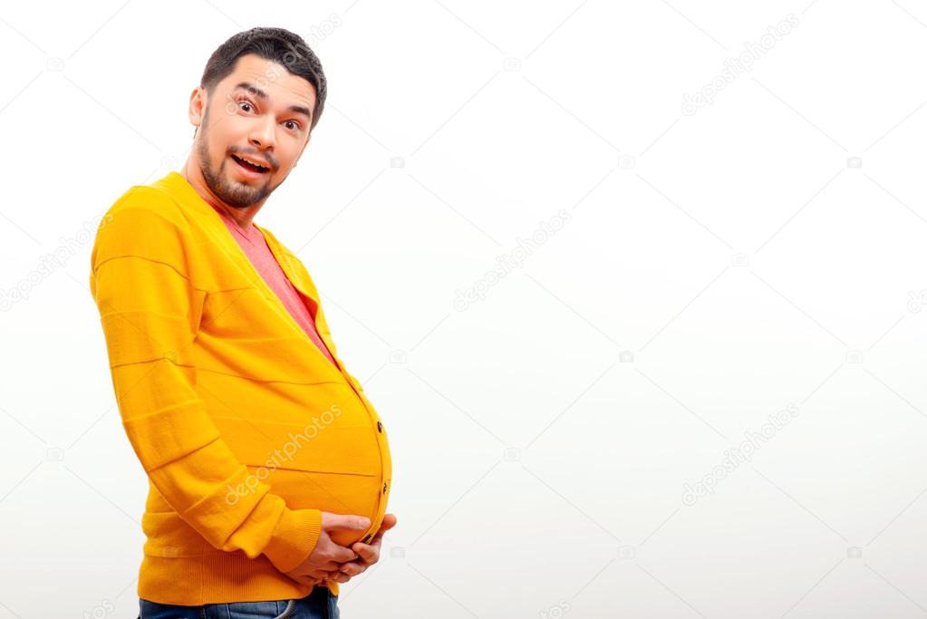 Conceptual image of a pregnant man