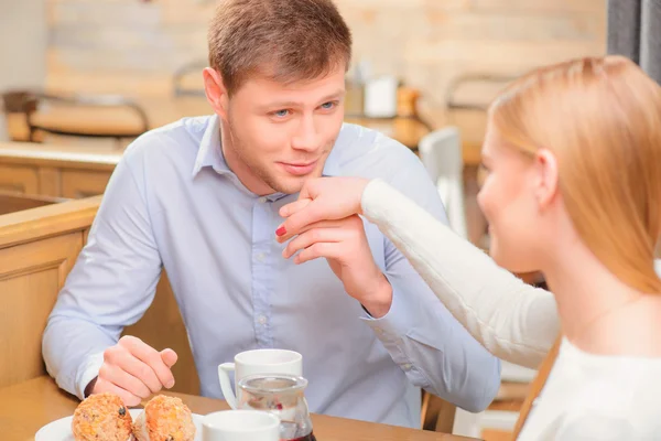 Beautiful young couple in cafe — Stock Photo, Image
