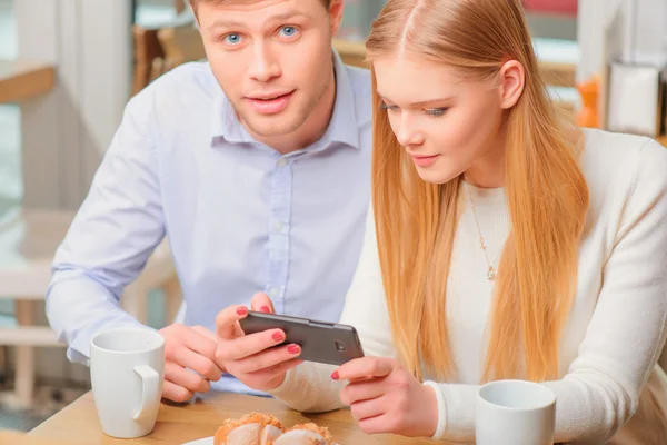 Beautiful woman and man in cafe — Stock Photo, Image