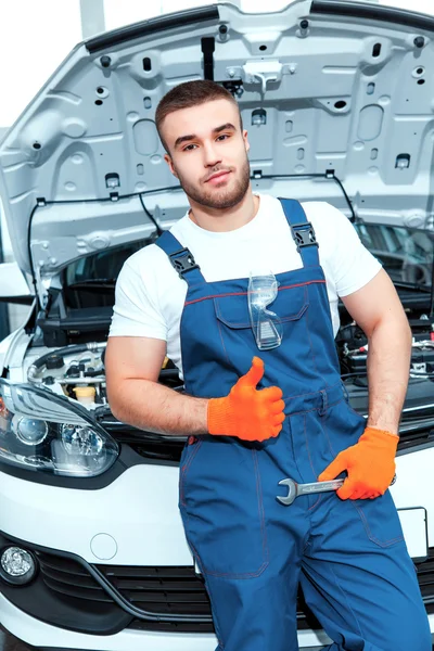 Car mechanics at the service station