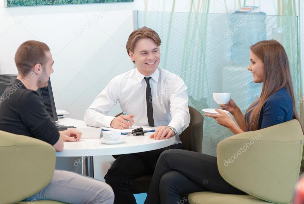Couple communicating with a salesman