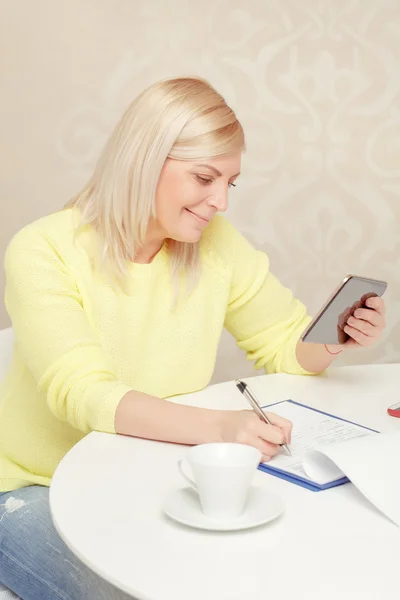 Woman watching at her tablet device — Stock Photo, Image