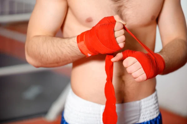 Sportsman binds boxing bandage — Stock Photo, Image