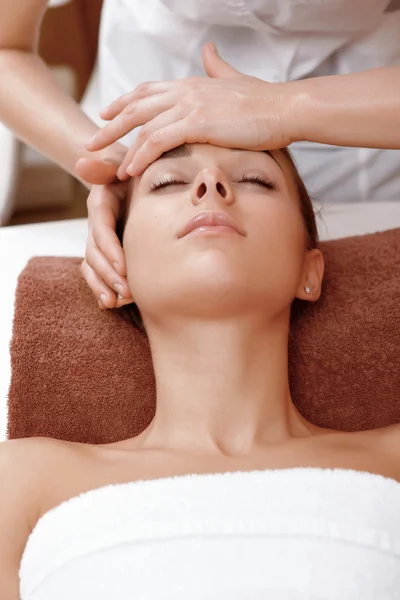 Beautician makes face massage