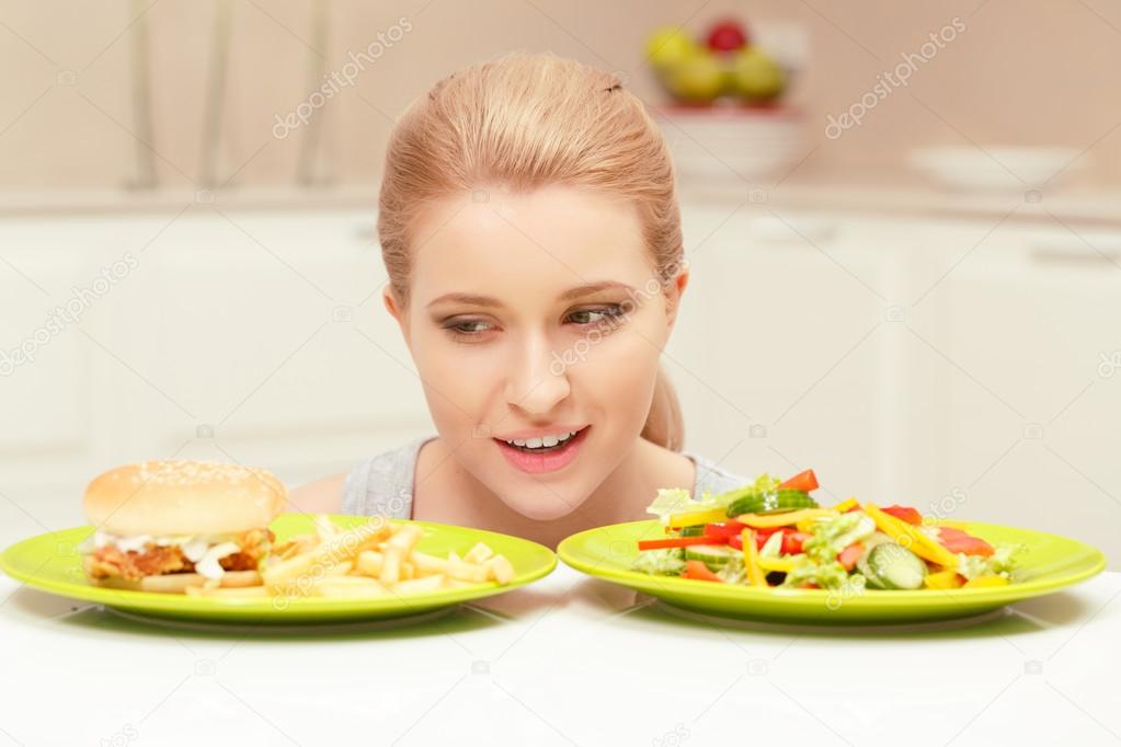 Young woman choosing lunch